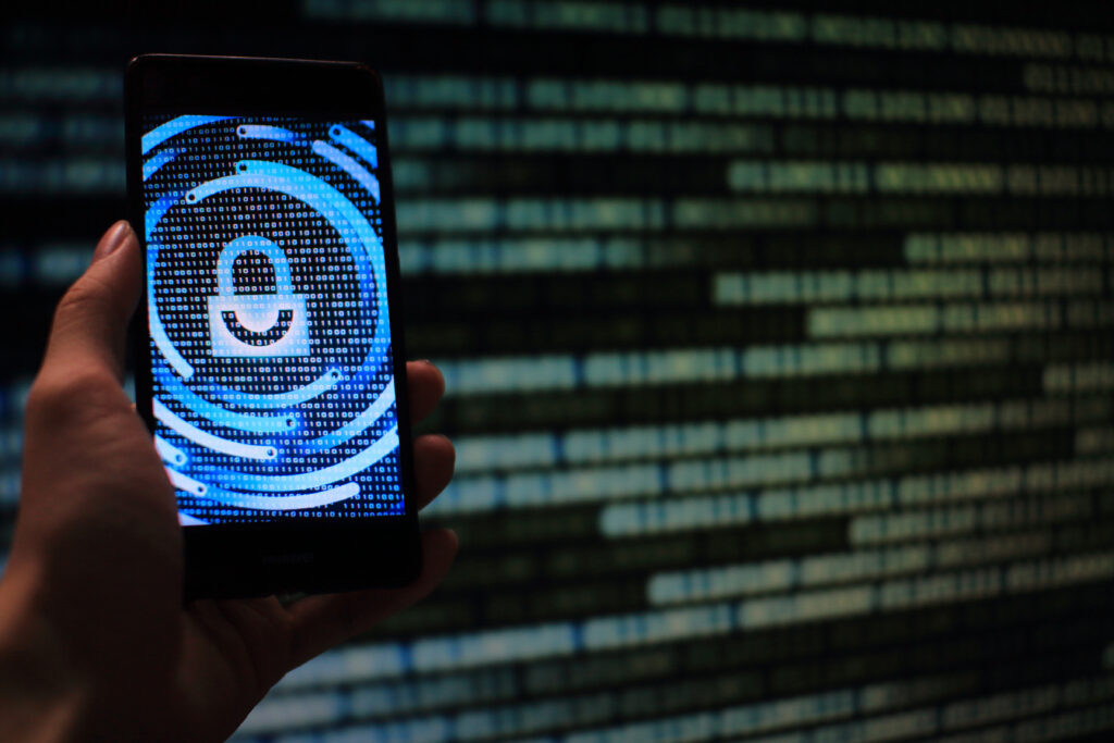 Discretionary Access Control in Cybersecurity: A Complete Guide 3 close up person using mobile phone 1